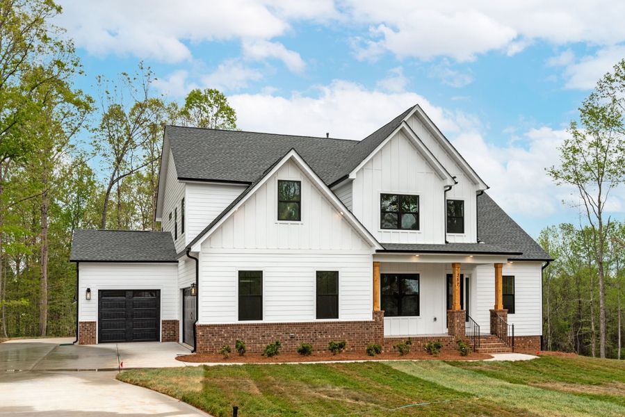 This open first-floor living plan exudes sophisticated charm. The flexible foyer space can be a dining room, music room, or parlor. A well-lit study opens to an extended covered porch, which can be a 4-seasons room. The family room features a choice of fi