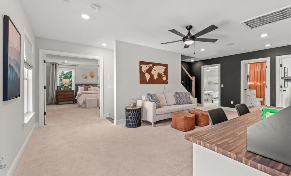 Furnished interior in a model home at Enclave at Riverdale in Huntersville (Image 8).