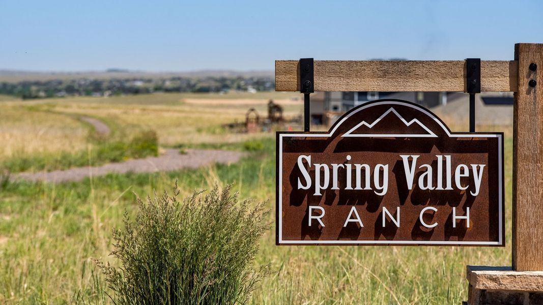 Entrance to the Spring Valley Ranch community in Elizabeth, CO, featuring signage and landscaping (Image 2).