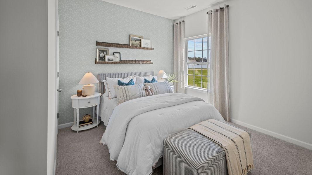 Furnished interior in a model home at East Ridge in Ayden (Image 18).