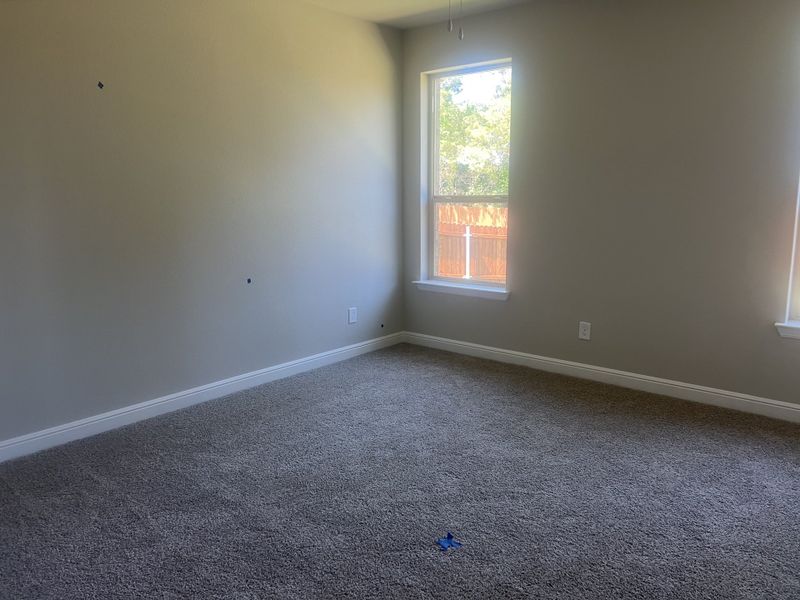 A bright, spacious room with plush carpeting, neutral walls, and large windows that let in ample natural light. A bright, spacious room with plush carpeting, neutral walls, and large windows that let in ample natural light.