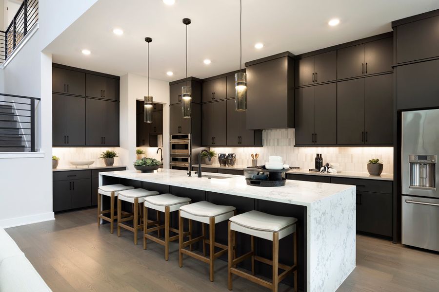 Furnished interior in a model home at Manors Collection - Freedom at Anthem in Kyle (Image 8).
