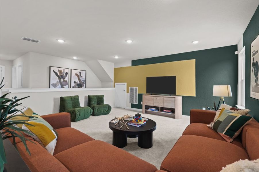A living room with a tv and couches. A living room with a tv and couches.