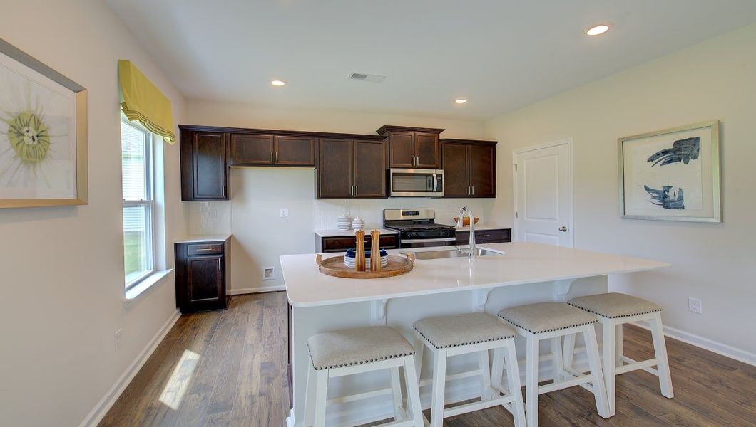 Furnished interior in a model home at Tap Root Farms in Fletcher (Image 3).