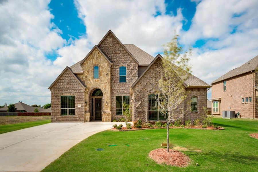 Front exterior of a home in the Alanis Crossing community, located in Sachse, TX (Image 1). Front exterior of a home in the Alanis Crossing community, located in Sachse, TX (Image 1).