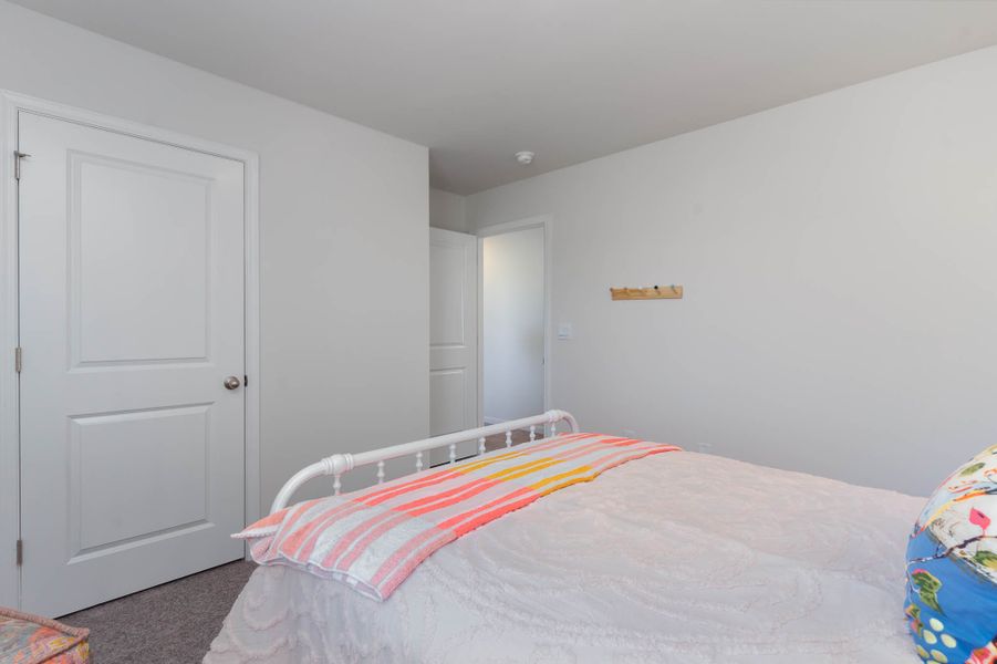 Furnished interior in a model home at Island Green in Myrtle Beach (Image 44).