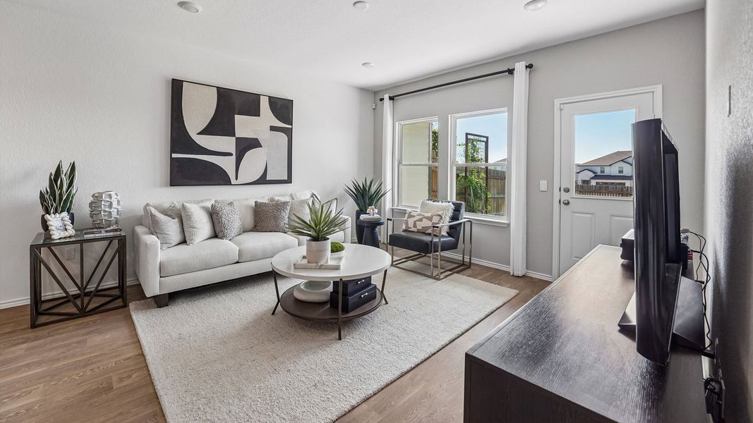 Furnished interior in a model home at Palomino in Manor (Image 8).