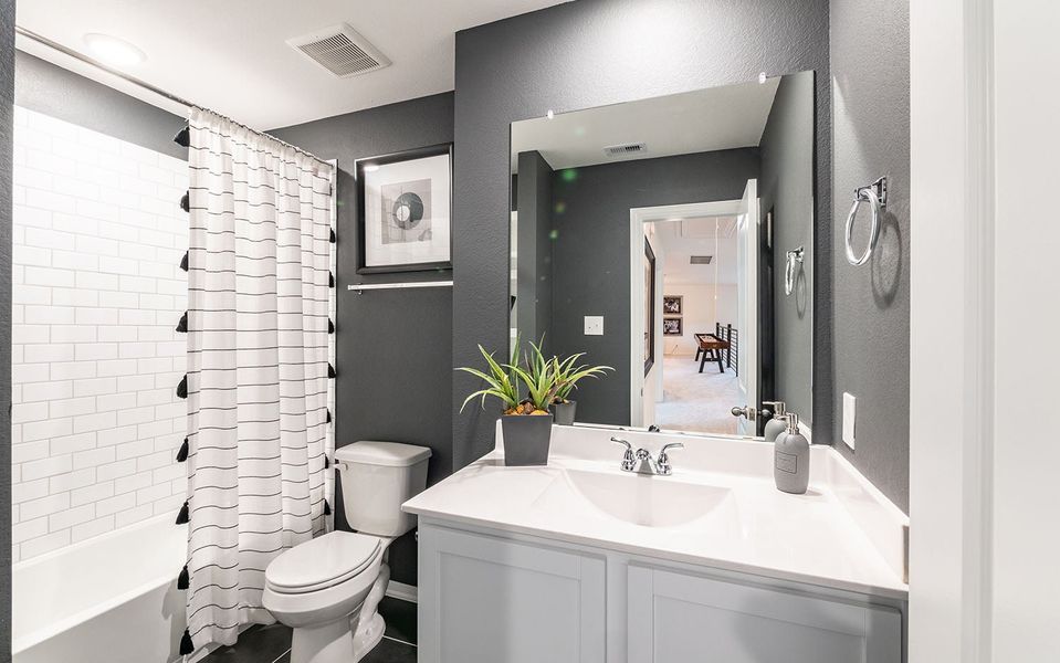 Furnished interior in a model home at Infinity Square in Kyle (Image 12).