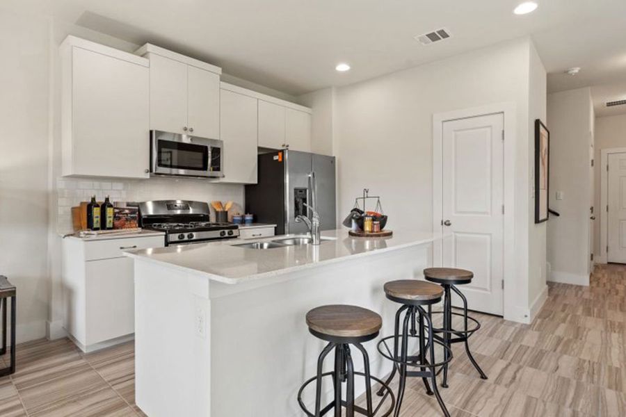 Furnished interior in a model home at Saddle Creek Twinhomes in Georgetown (Image 29).