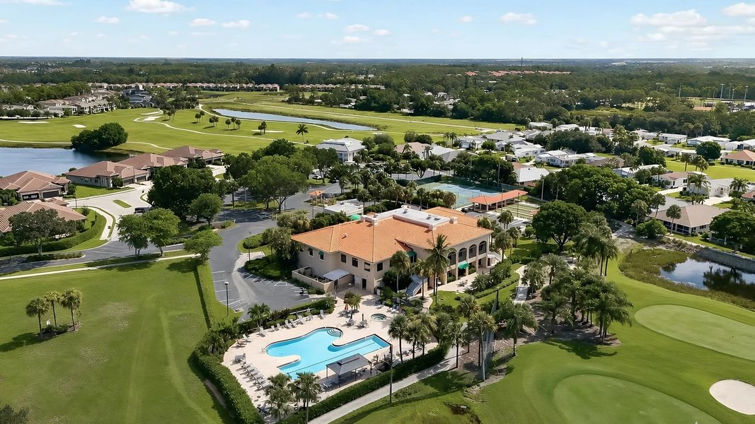 Aerial of clubhouse surrounded by greenery and amenities