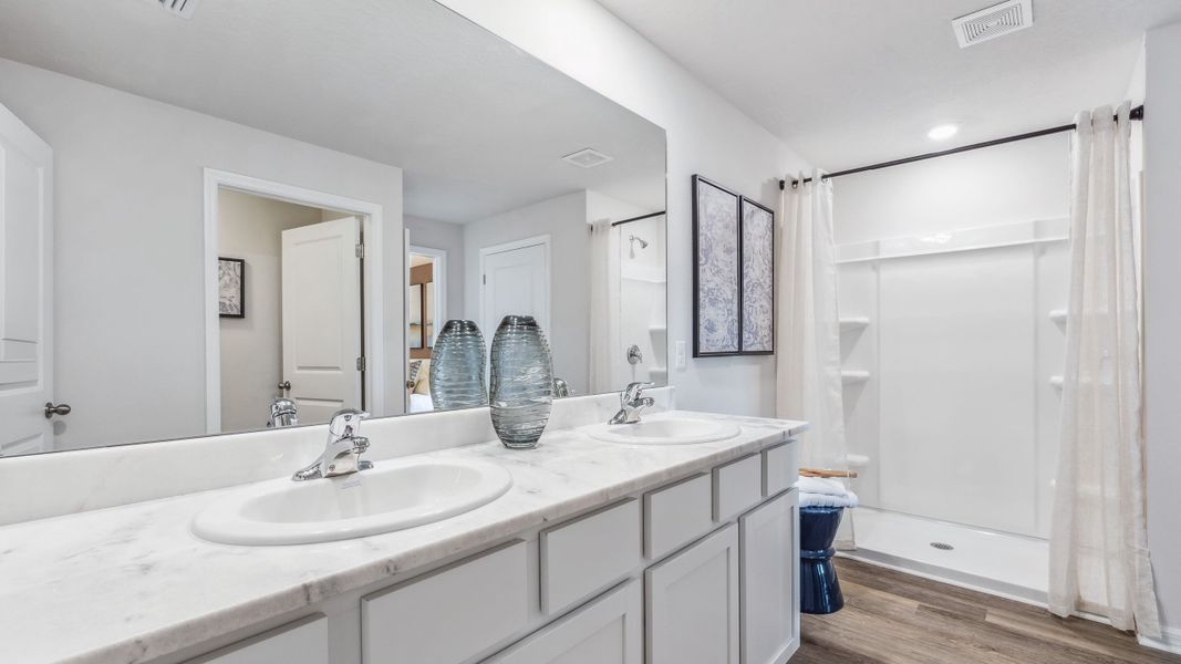 Furnished interior in a model home at Bella Lago in Parrish (Image 25).