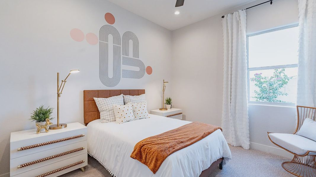 Modern bedroom in Windrose features unique geometric wall art, plush textiles, and sleek lighting.