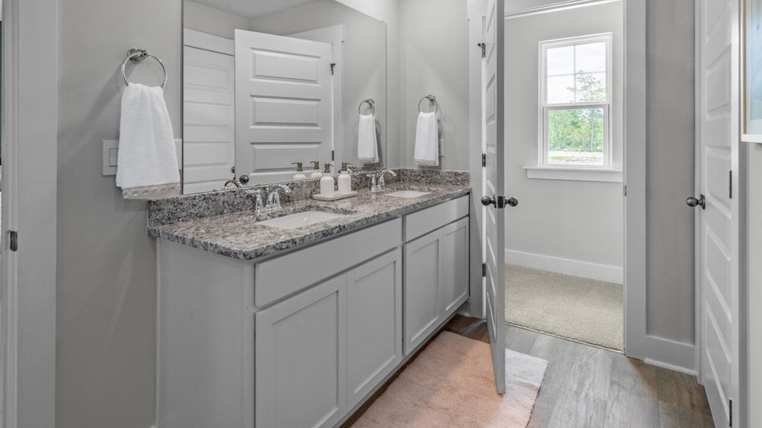 Furnished interior in a model home at Eagle Creek in Bolivia (Image 30).