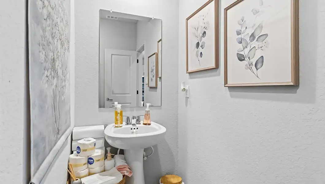 Furnished interior in a model home at The Woodlands at Medina Hills in Mico (Image 17).