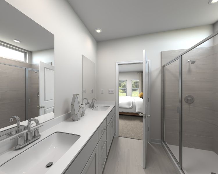 The primary bathroom offers dual vanity sinks and a walk-in shower.