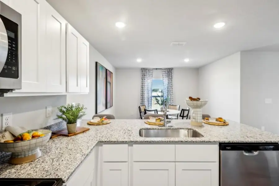 A kitchen with white cabinets. A kitchen with white cabinets.
