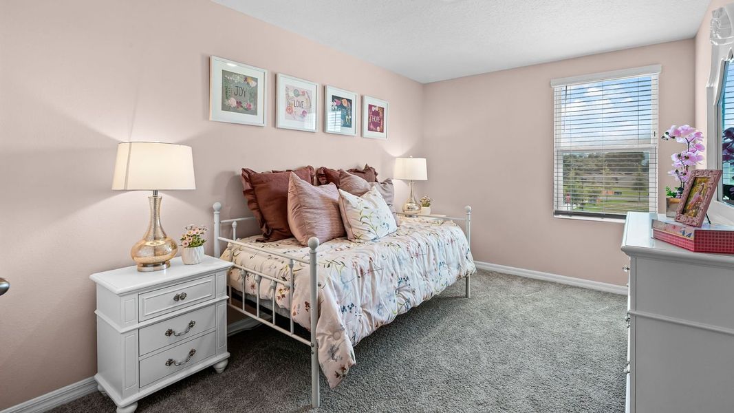 Furnished interior in a model home at Evergreen Park in Kissimmee (Image 17).
