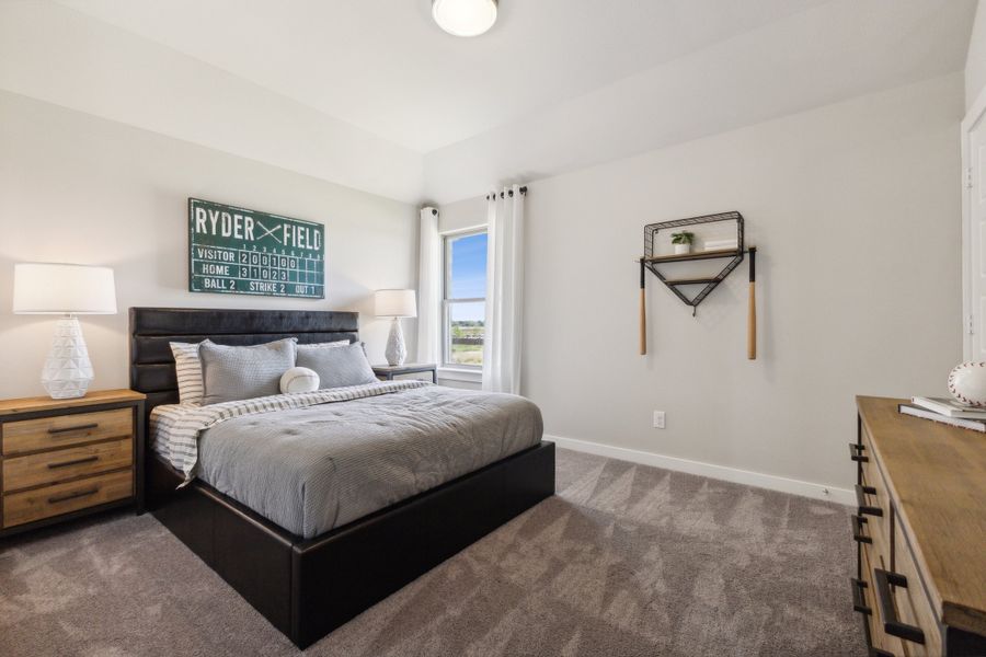 REPRESENTATIVE PHOTO – Bedroom in a Stratton Place new home in Greenville TX by Trophy Signature Homes