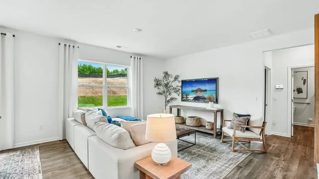 Furnished interior in a model home at Copper Run South Single Family in Durham (Image 7).