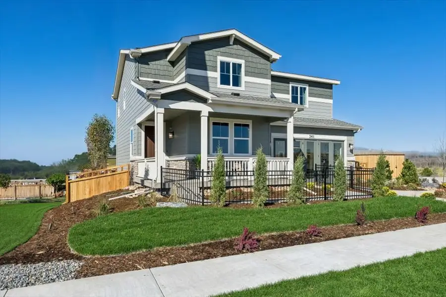 A house with a fence and yard.