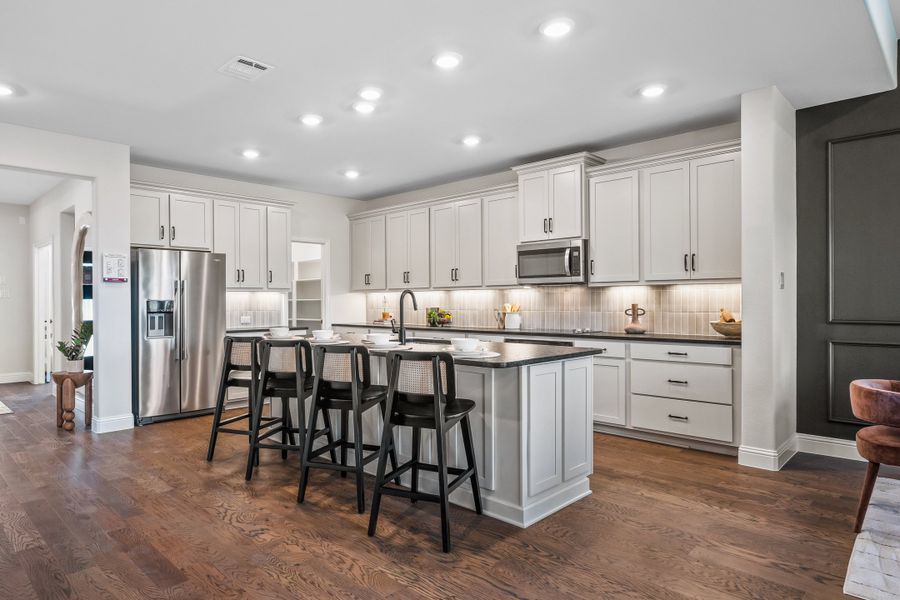 Furnished interior in a model home at Cottonwood Creek: Fields 40' in Dorchester (Image 4).