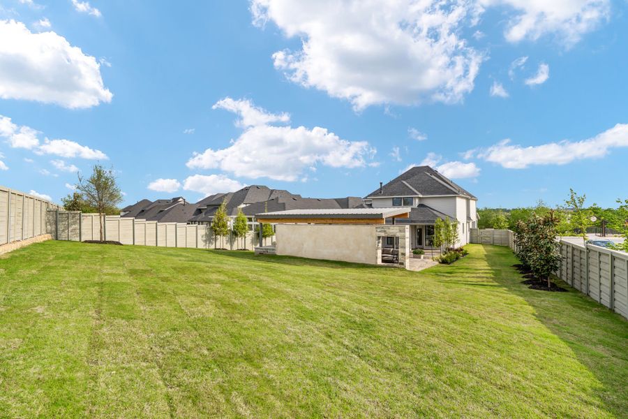 American Legend Homes' model in Treeline - Backyard