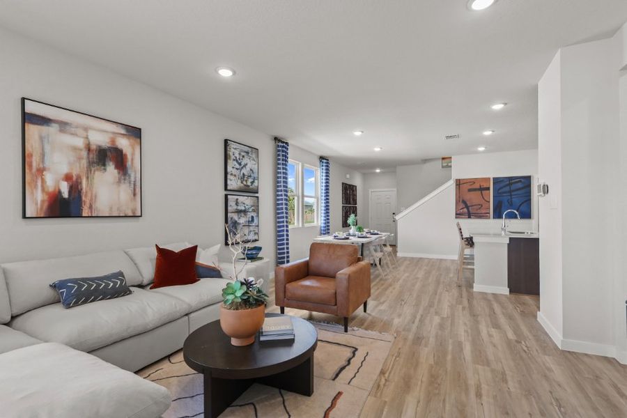 A living room with a wood floor.