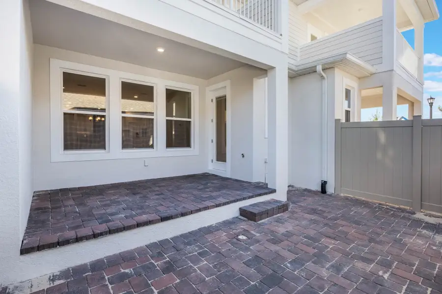 Exterior details of a home in Harvest at Ovation - Townhomes, Winter Garden (Image 48).
