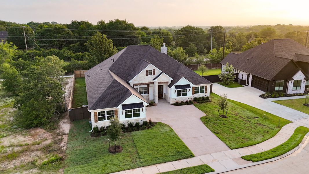 Front exterior of a home in the Pebble Creek community, located in College Station, TX (Image 12). Front exterior of a home in the Pebble Creek community, located in College Station, TX (Image 12).