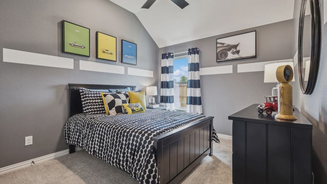Elegantly designed bedroom with a vaulted ceiling in Churchill. Stylish decor and bold color accents. Elegantly designed bedroom with a vaulted ceiling in Churchill. Stylish decor and bold color accents.