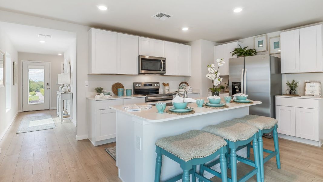 Furnished interior in a model home at Cali Cove in Punta Gorda (Image 15).
