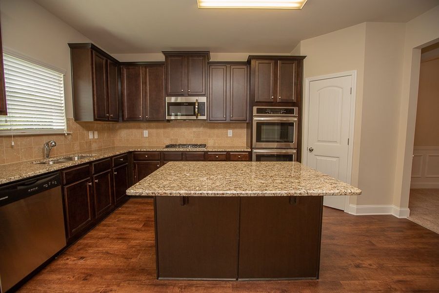 Furnished interior in a model home at Creekside at Scarborough in College Park (Image 4).