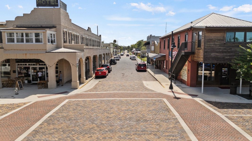 Brick-paved street with historic buildings in downtown St. Cloud, FL, offering charm and character near Cyrene at Harmony. Brick-paved street with historic buildings in downtown St. Cloud, FL, offering charm and character near Cyrene at Harmony.