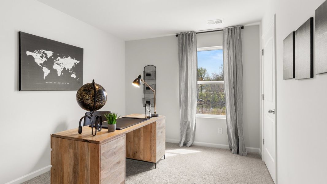 Furnished interior in a model home at Carlton in Douglasville (Image 24).
