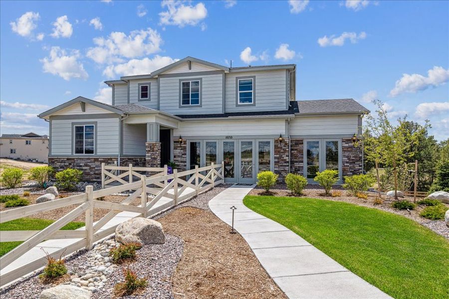 A house with a stone driveway.