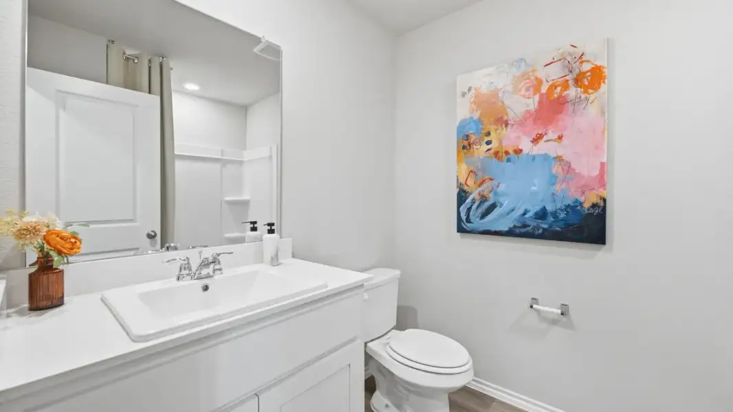 Furnished interior in a model home at Webster Meadows in Ponder (Image 18).