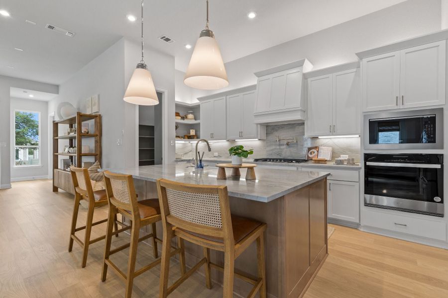 Furnished interior in a model home at Wolf Ranch in Georgetown (Image 7).