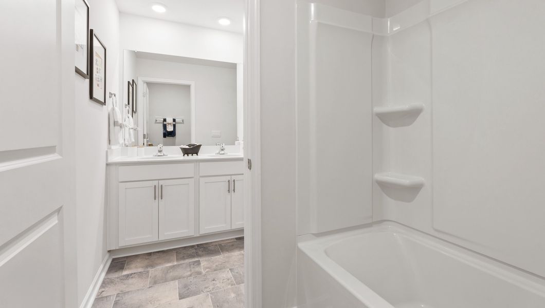 Furnished interior in a model home at Paddock Point in Roebuck (Image 13).