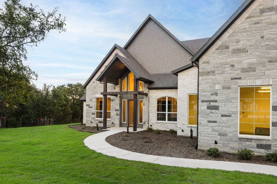 Front exterior of a home in the Lola Creek Ranch community, located in Boyd, TX (Image 11).