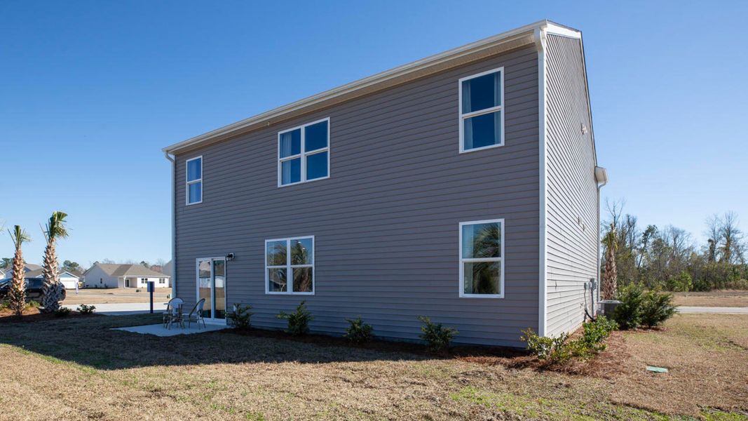 Front exterior of a home in the The Grove at Blake Farm community, located in Wilmington, NC (Image 5). Front exterior of a home in the The Grove at Blake Farm community, located in Wilmington, NC (Image 5).