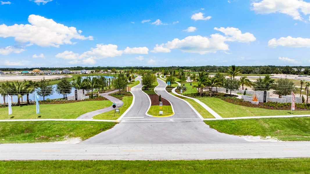 Entrance to the The Towns at Firethorn community in Parrish, FL, featuring signage and landscaping (Image 13).