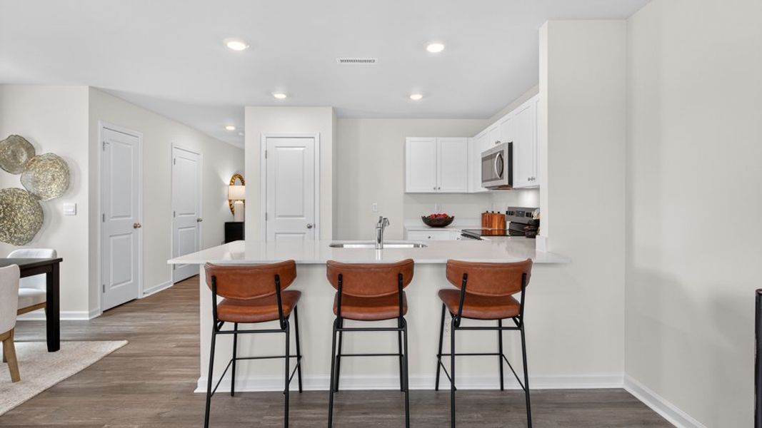 Furnished interior in a model home at The Townes at Belle Grove in Wendell (Image 8).