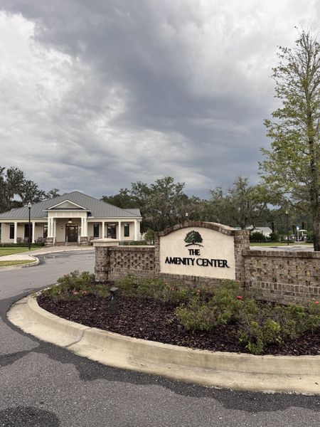 An inviting amenity center with lush landscaping in TrailMark by Dream Finders Homes (St. Augustine, FL).
