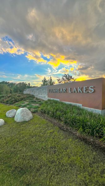 Entrance to the Fulshear Lakes community in Fulshear, TX, featuring signage and landscaping (Image 12).