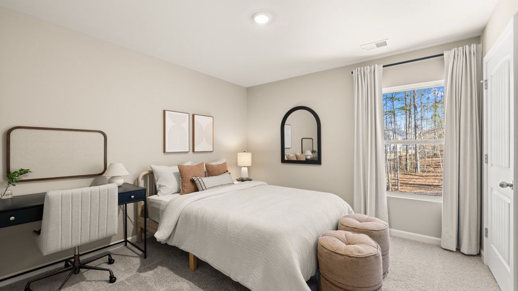 Furnished interior in a model home at South Wind in Fairburn (Image 20).