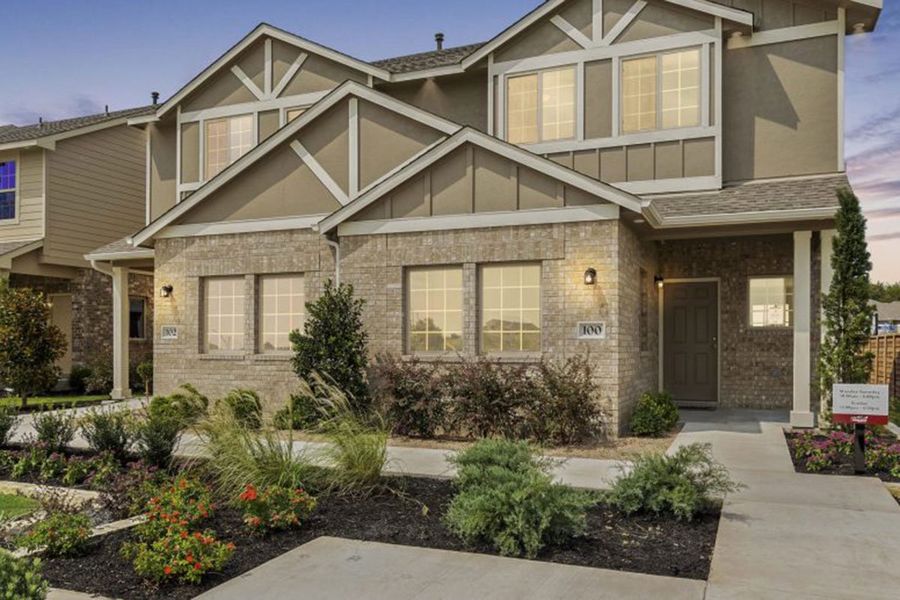 Front exterior of a home in the Saddle Creek Twinhomes community, located in Georgetown, TX (Image 5).