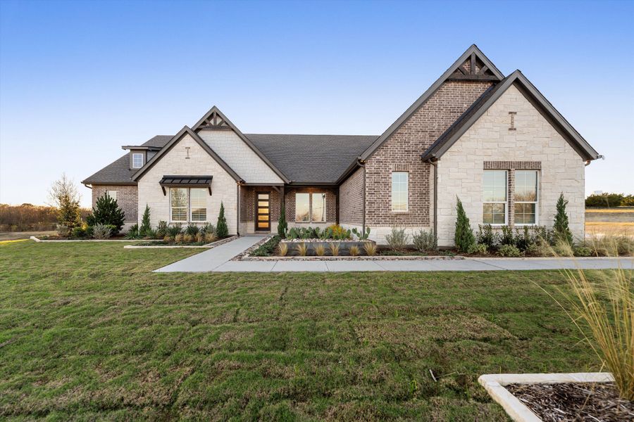 Front exterior of a home in the Grayson Ridge community, located in Van Alstyne, TX (Image 2).