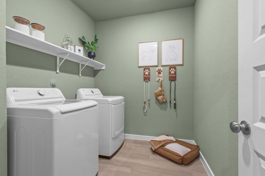 A laundry room with a washer and dryer. A laundry room with a washer and dryer.