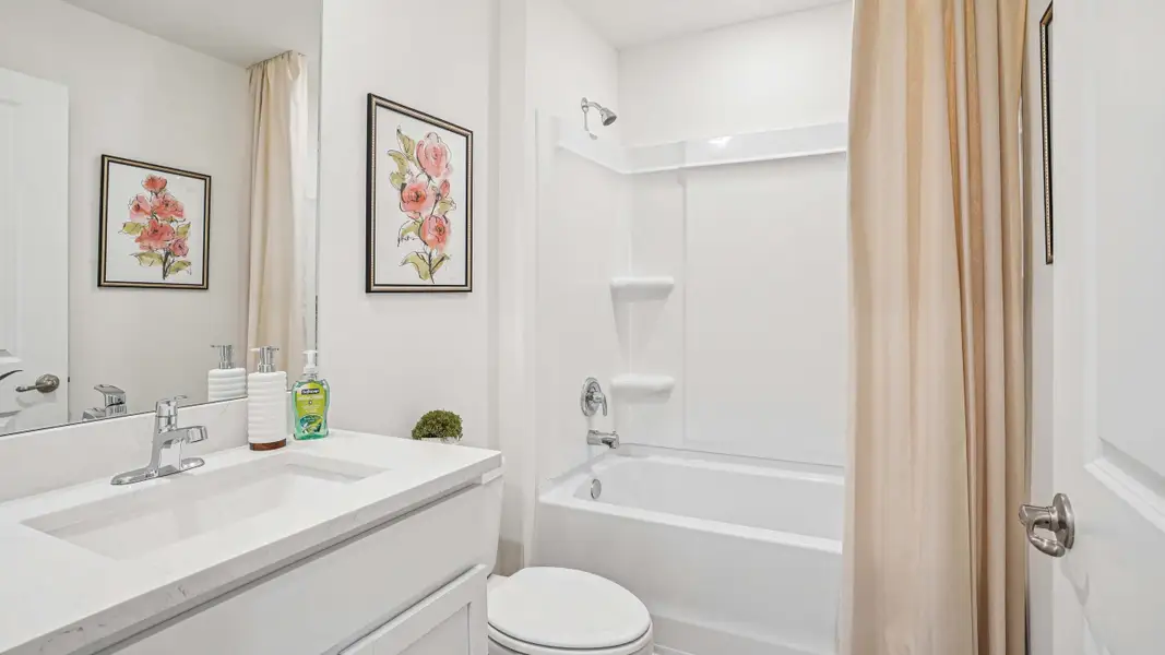 Furnished interior in a model home at Fletcher Trace in Alachua (Image 22).