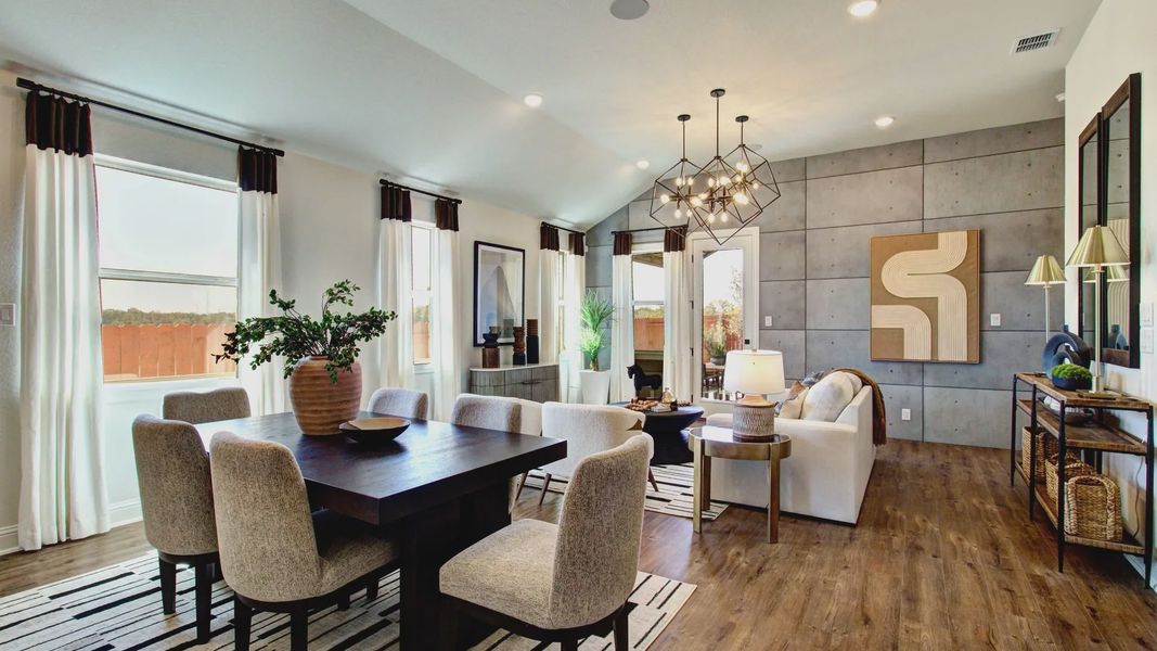 Expansive living space features elegant chandelier and large windows, with refined decor at Meyer Ranch. Expansive living space features elegant chandelier and large windows, with refined decor at Meyer Ranch.